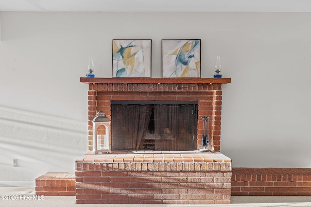 interior details with a brick fireplace