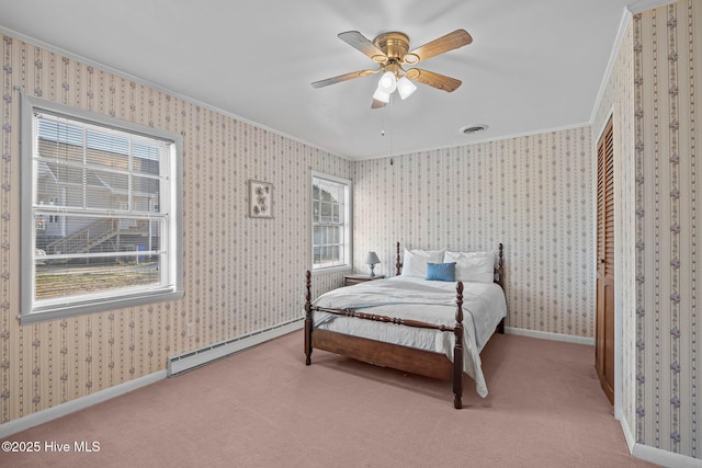 carpeted bedroom with a baseboard radiator, visible vents, baseboards, ornamental molding, and wallpapered walls