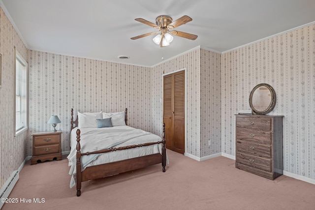 bedroom featuring baseboards, crown molding, baseboard heating, and wallpapered walls