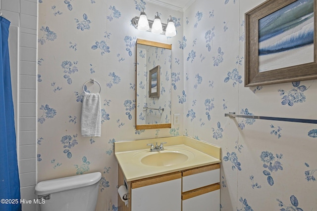 bathroom featuring toilet and vanity