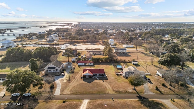 drone / aerial view with a water view and a residential view