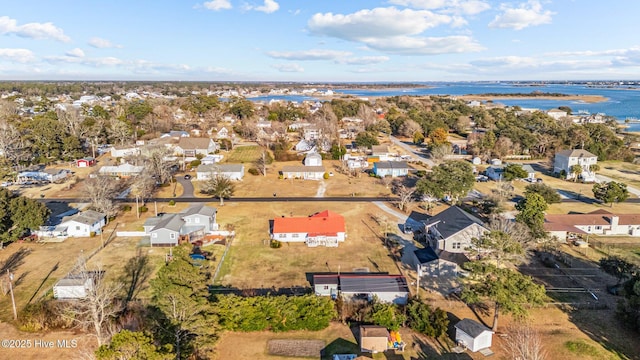 drone / aerial view with a residential view and a water view