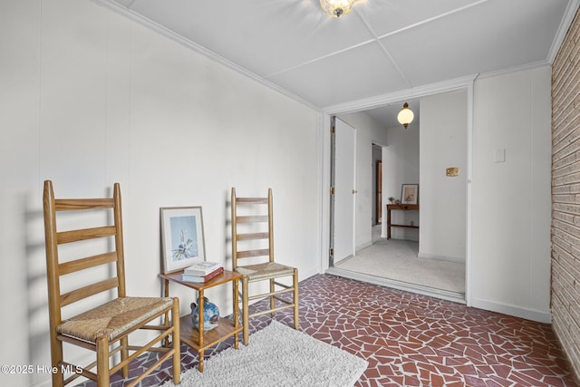 interior space featuring baseboards and crown molding