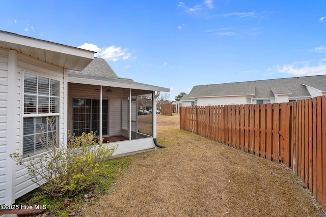 view of yard with a sunroom