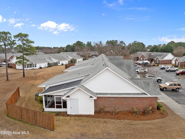 view of front of house featuring a sunroom