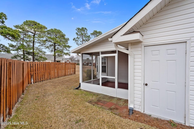 view of yard with a sunroom