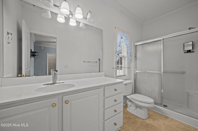 bathroom with tile patterned floors, ornamental molding, a shower with shower door, and vanity