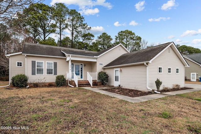 ranch-style house featuring a front lawn