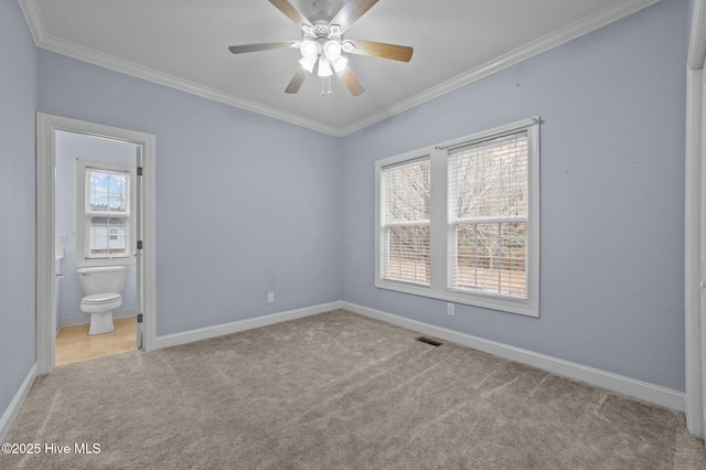 unfurnished bedroom featuring light carpet, connected bathroom, crown molding, and ceiling fan