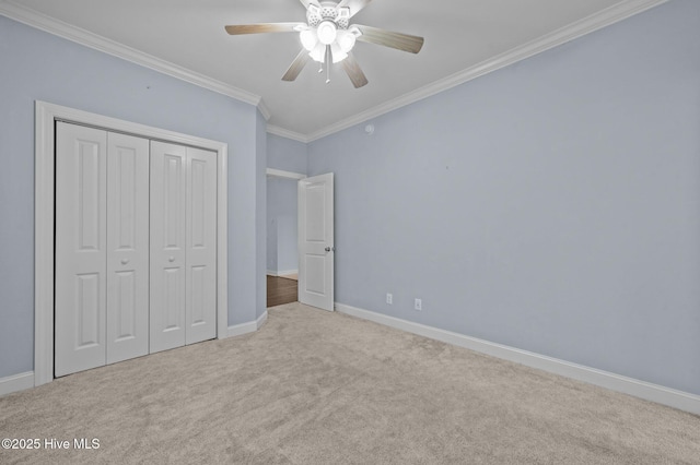 225 Adams Ln, Washington, NC 27889 - unfurnished bedroom with ornamental molding, carpet flooring, a closet, baseboards, and a ceiling fan