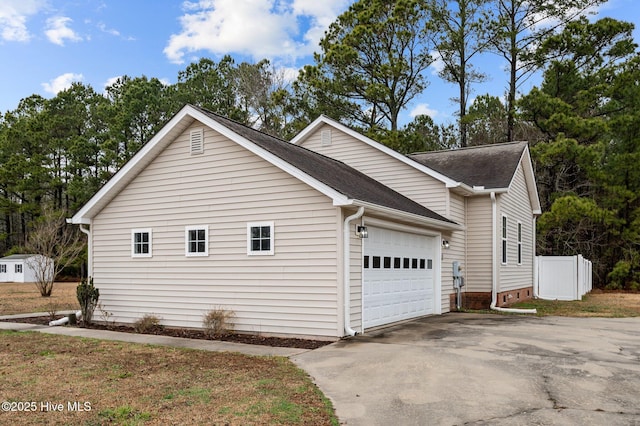 view of side of property featuring a garage