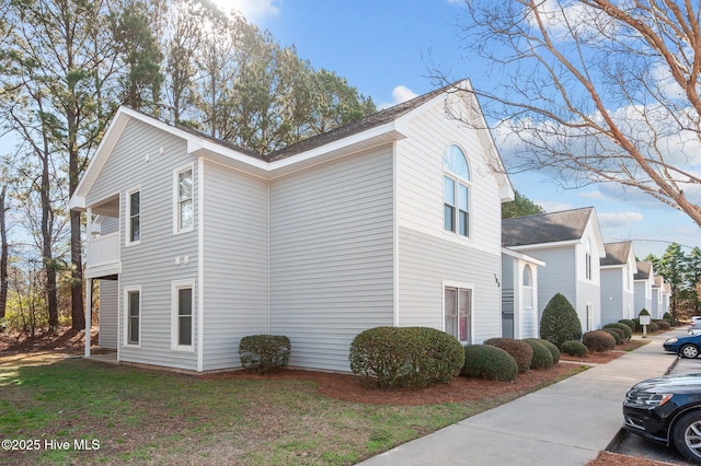 view of home's exterior featuring a lawn