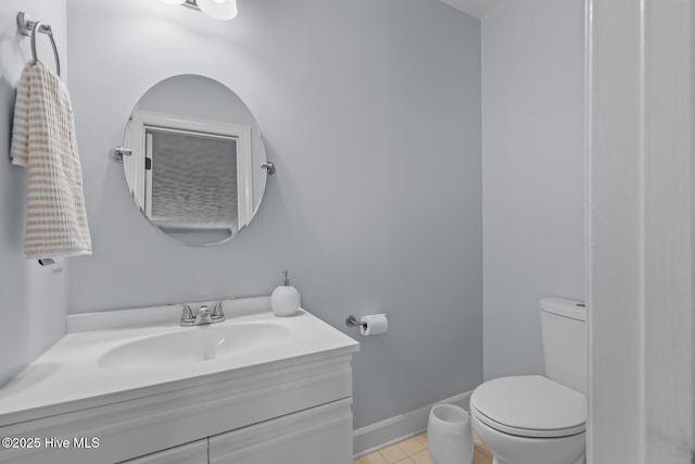 bathroom featuring vanity, toilet, and tile patterned floors