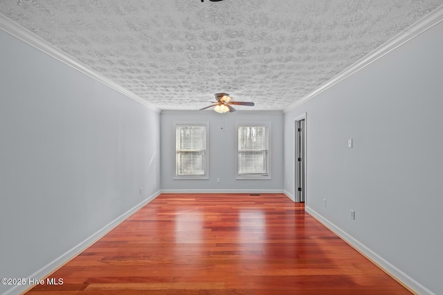 unfurnished room with ceiling fan, hardwood / wood-style flooring, a textured ceiling, and ornamental molding