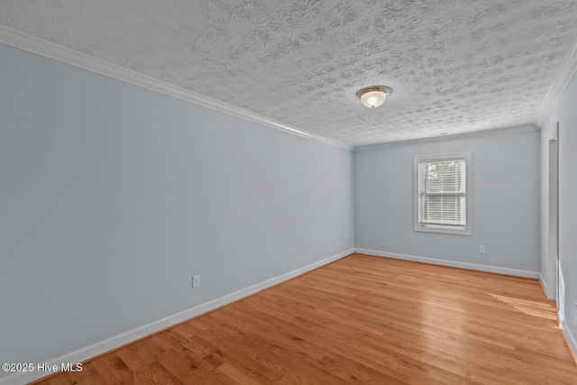 unfurnished room with light wood-type flooring, crown molding, and a textured ceiling