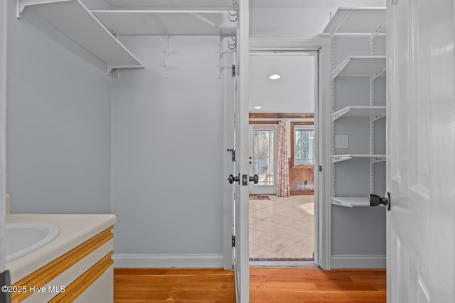 walk in closet featuring light wood-type flooring