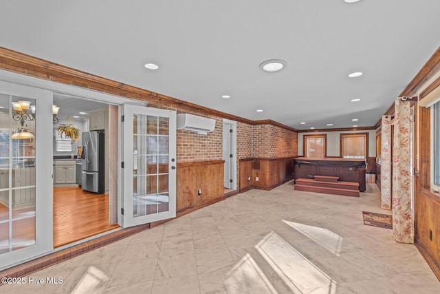 interior space with an AC wall unit and french doors