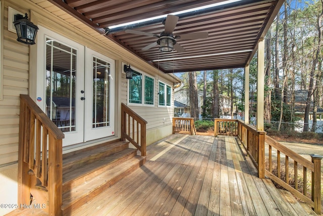 deck with french doors and ceiling fan