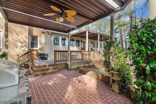 view of patio / terrace featuring grilling area, a deck, and ceiling fan