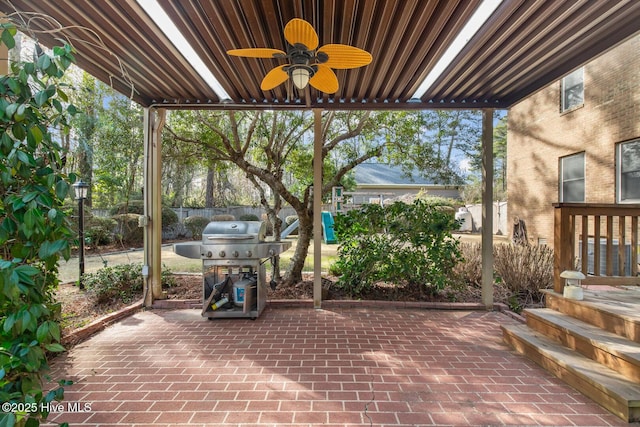 view of patio featuring ceiling fan and a grill