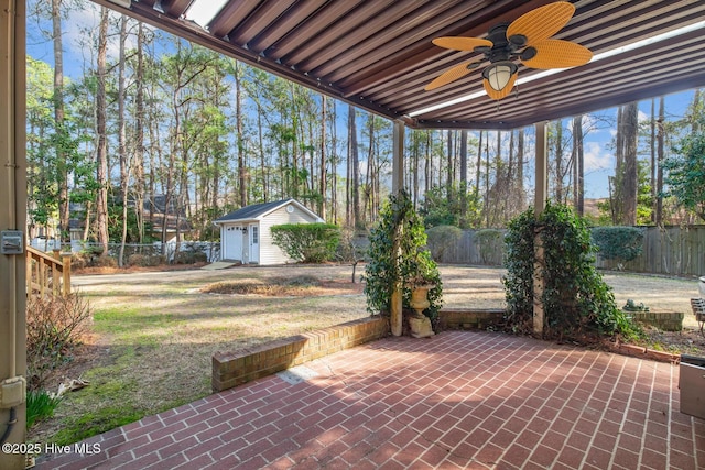 view of patio featuring a storage unit and ceiling fan