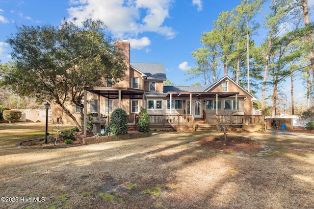 view of front of home featuring a front yard and a porch