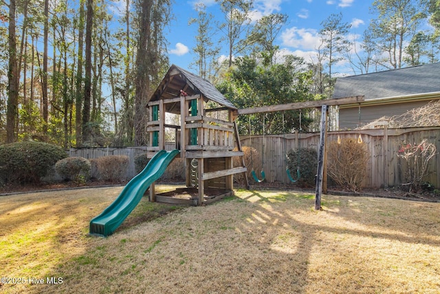 view of jungle gym featuring a lawn