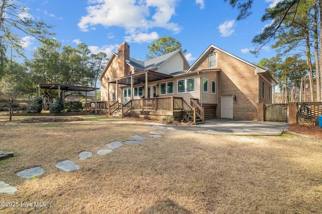 back of house featuring a deck