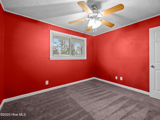 empty room featuring a ceiling fan, carpet, baseboards, visible vents, and a textured ceiling