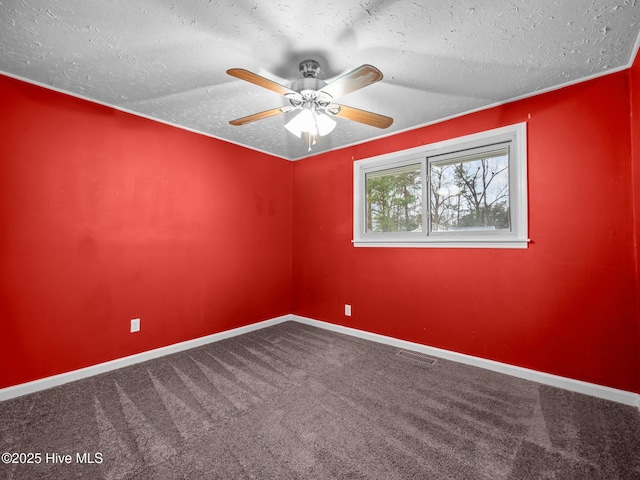 unfurnished room featuring carpet flooring, baseboards, a textured ceiling, and visible vents