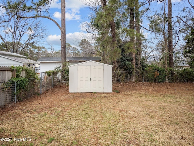 view of shed featuring a fenced backyard