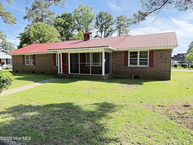 1207 Harrington St, Washington, NC 27889 - ranch-style house with a sunroom, a front lawn, metal roof, and a chimney