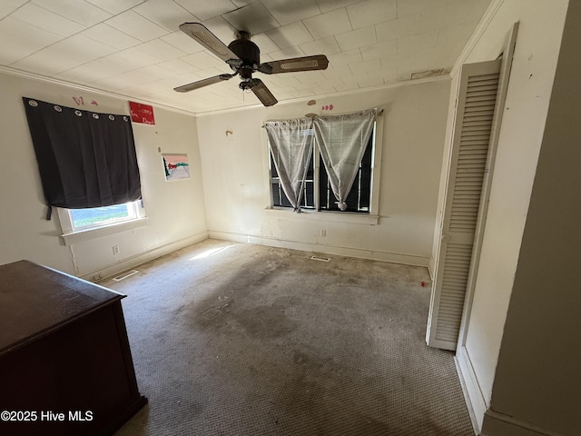 1207 Harrington St, Washington, NC 27889 - unfurnished bedroom featuring crown molding, carpet flooring, baseboards, and a ceiling fan