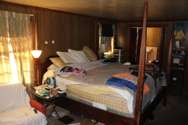 bedroom featuring wood walls