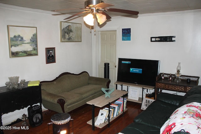 living room featuring ornamental molding, dark wood finished floors, and a ceiling fan