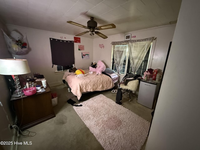 bedroom featuring a ceiling fan and refrigerator