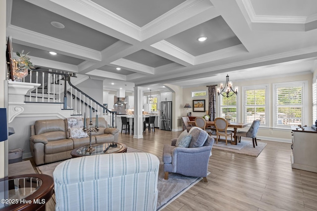 3953 Palm St SE, Bolivia, NC 28422 - living area with a chandelier, stairs, light wood-style flooring, coffered ceiling, and beam ceiling