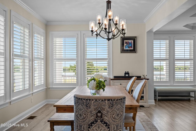 3953 Palm St SE, Bolivia, NC 28422 - dining room featuring a chandelier, plenty of natural light, light wood-type flooring, and ornamental molding