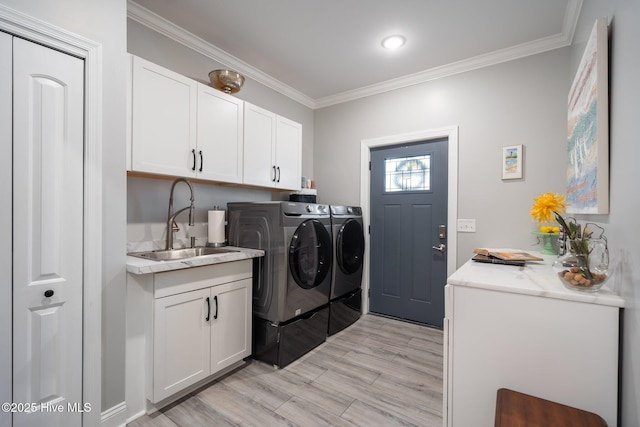 3953 Palm St SE, Bolivia, NC 28422 - clothes washing area with independent washer and dryer, light wood-style floors, crown molding, and cabinet space