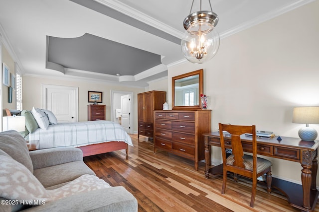 3953 Palm St SE, Bolivia, NC 28422 - bedroom featuring a raised ceiling, ornamental molding, wood-type flooring, a chandelier, and a desk