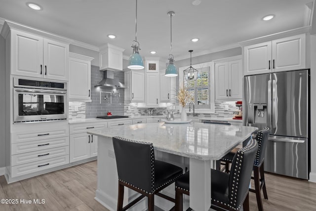 3953 Palm St SE, Bolivia, NC 28422 - kitchen featuring stainless steel appliances, white cabinetry, decorative backsplash, a breakfast bar area, and ornamental molding