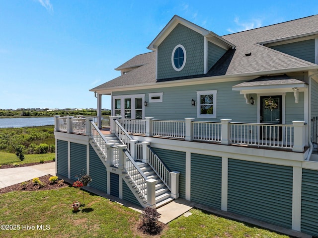 3953 Palm St SE, Bolivia, NC 28422 - back of house with roof with shingles, a water view, and stairs