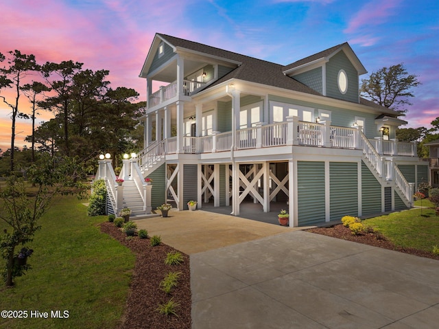 3953 Palm St SE, Bolivia, NC 28422 - raised beach house featuring stairway, a balcony, covered porch, and roof with shingles