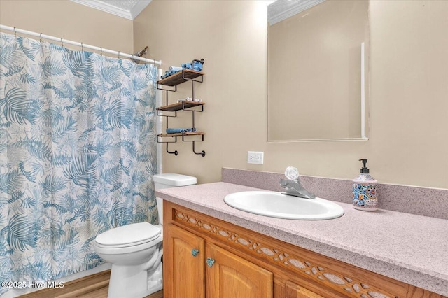 bathroom featuring toilet, curtained shower, crown molding, and vanity