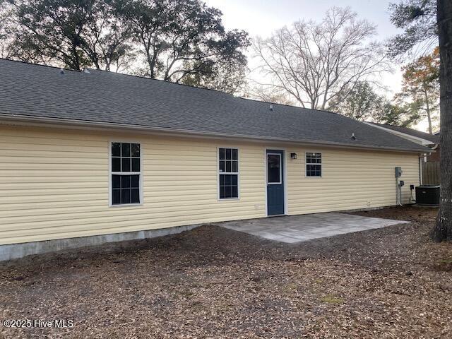 back of house with a patio and central air condition unit