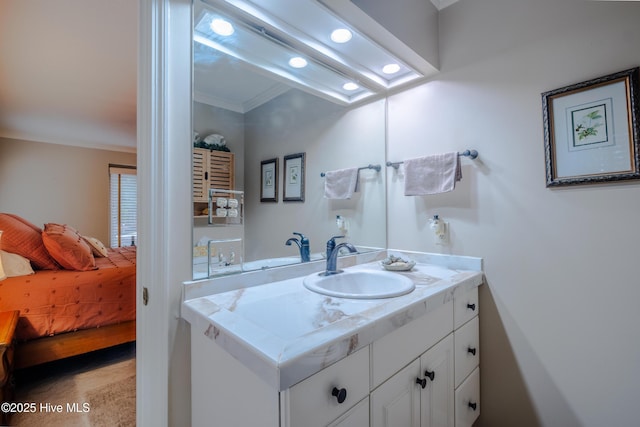 ensuite bathroom with recessed lighting, ensuite bathroom, vanity, and crown molding