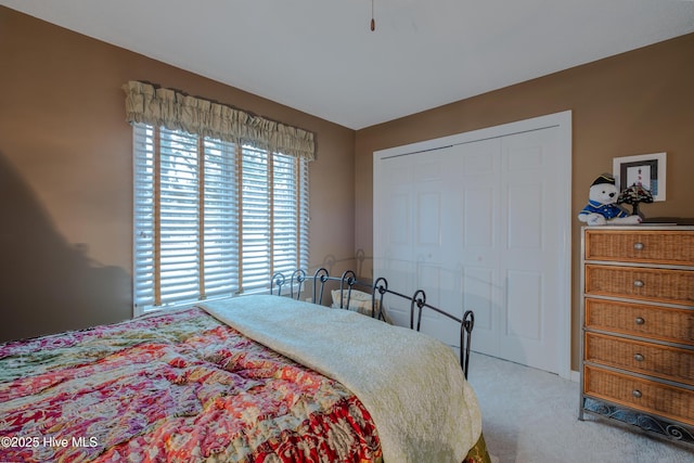 bedroom featuring a closet and carpet