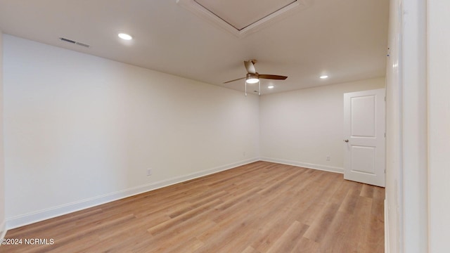 spare room featuring baseboards, visible vents, a ceiling fan, light wood-type flooring, and recessed lighting