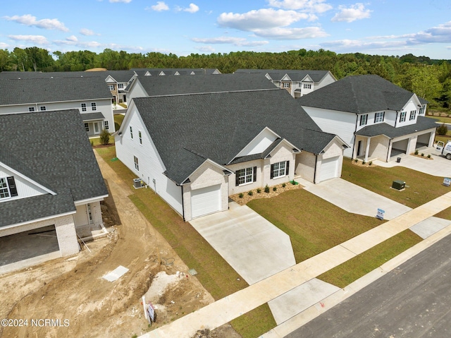 birds eye view of property with a residential view