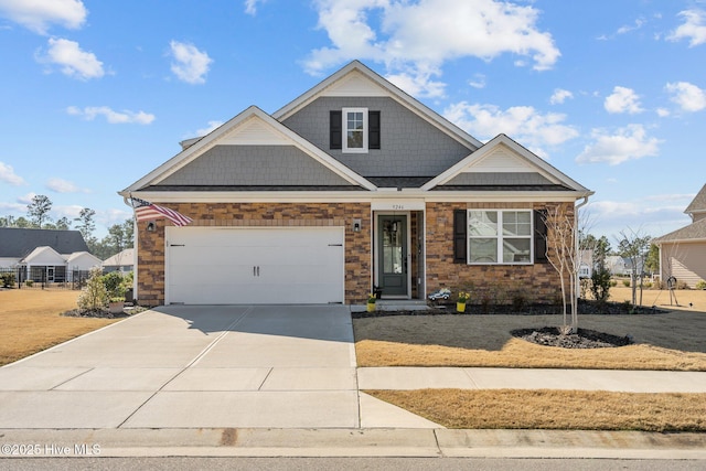 view of front of house with a front yard and a garage